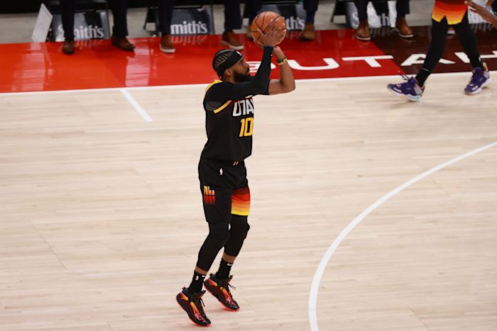 Mike Conley (10) shoots a three pointer in game five against the Memphis Grizzlies